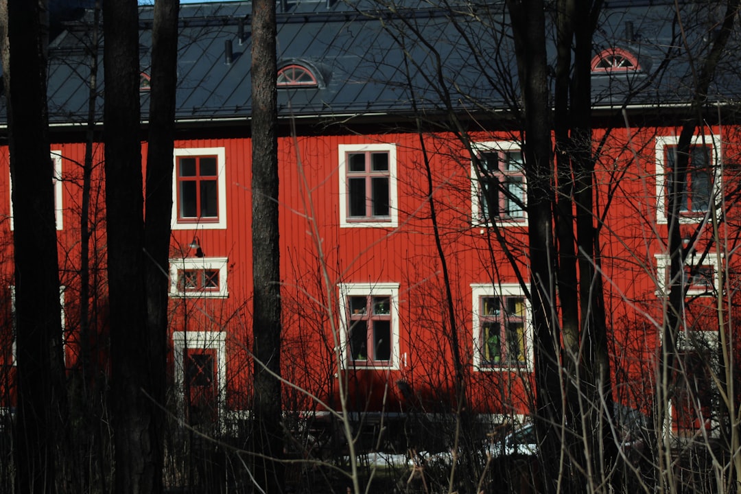A row of modern suburban family houses on a quiet street.